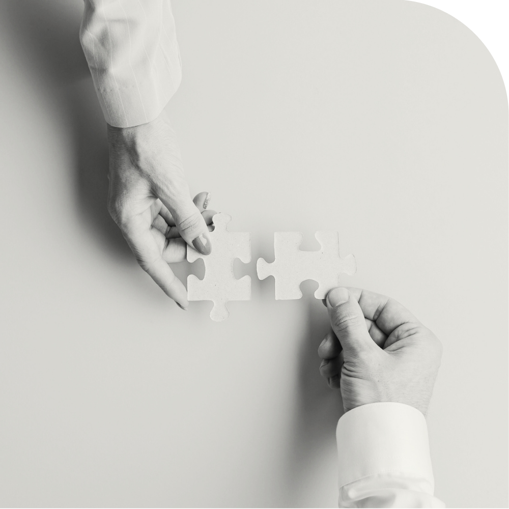 IMG - Hands Putting Puzzle Together